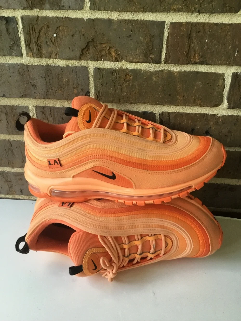 Nike Women’s Air Max 97 in Orange and Coral